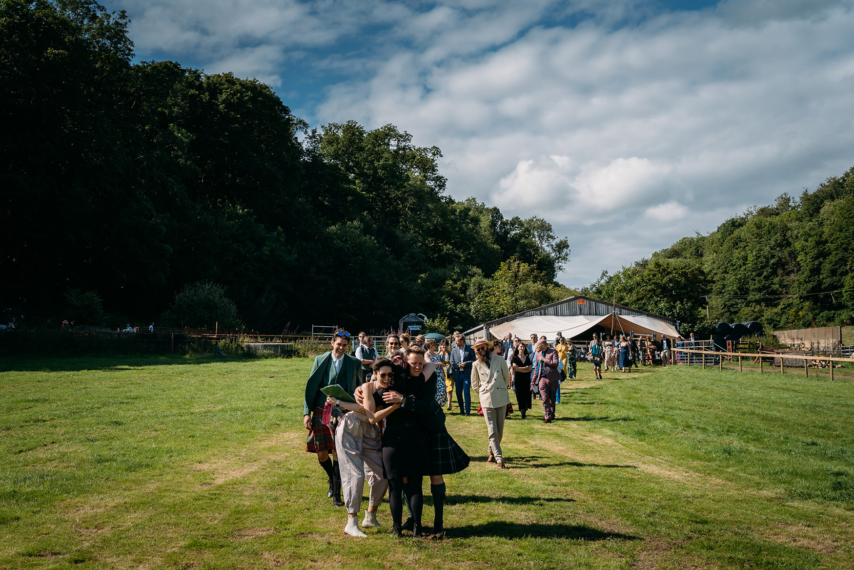 Fin Flükra hugs couple - airbnb wedding advice