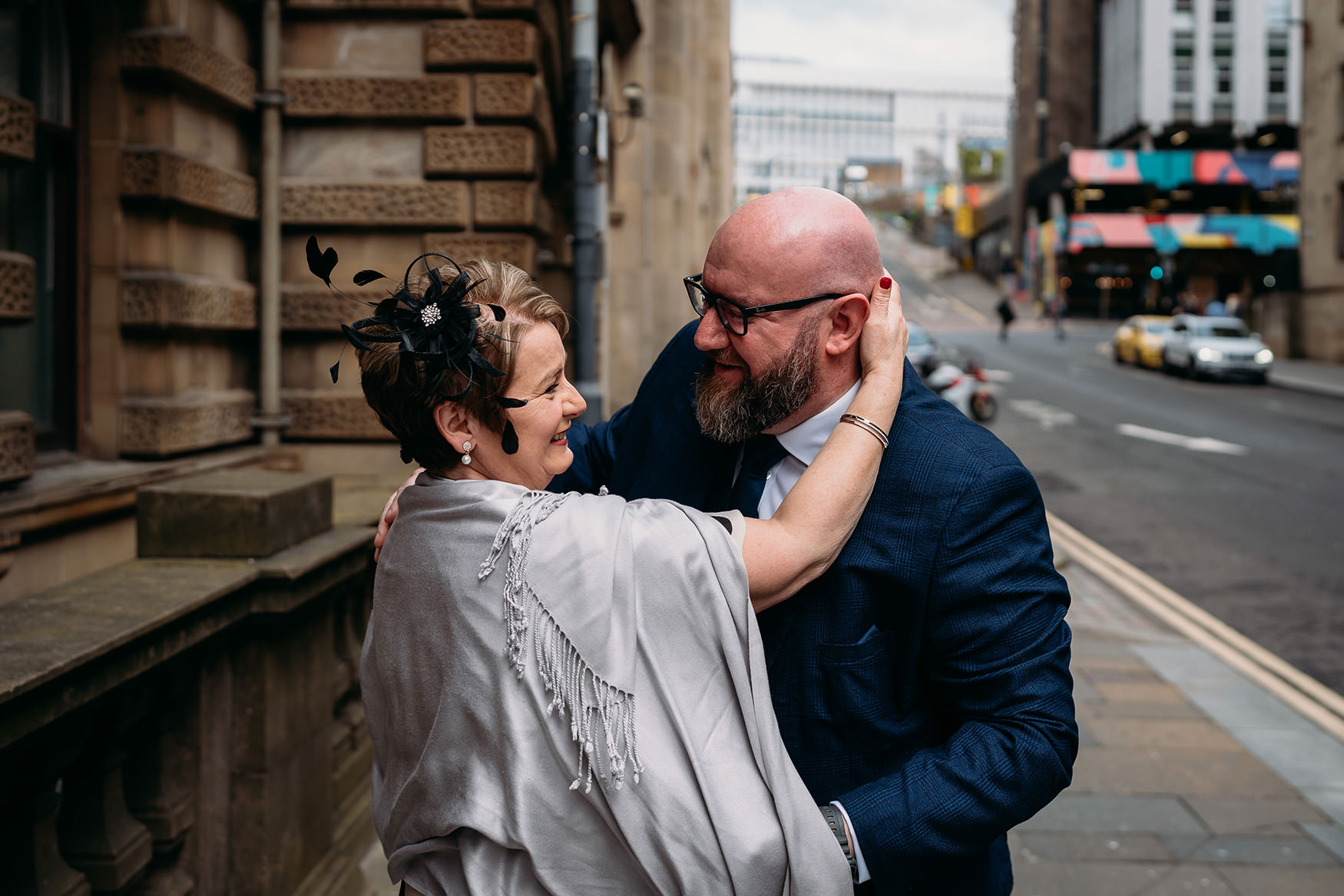 Mother and son hug during Glasgow micro wedding at 23 Montrose Street