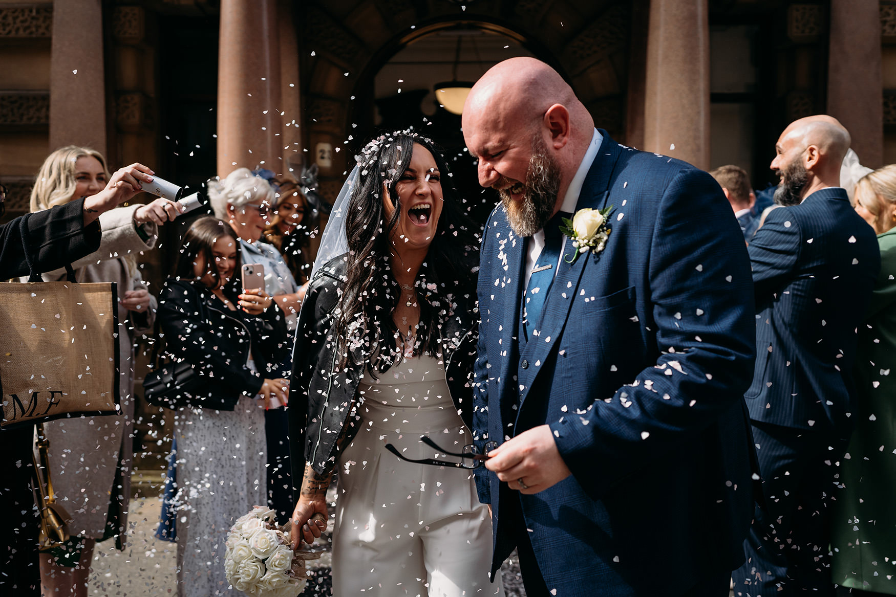 couple leave amongst confetti at 23 Montrose Street during their Glasgow micro wedding