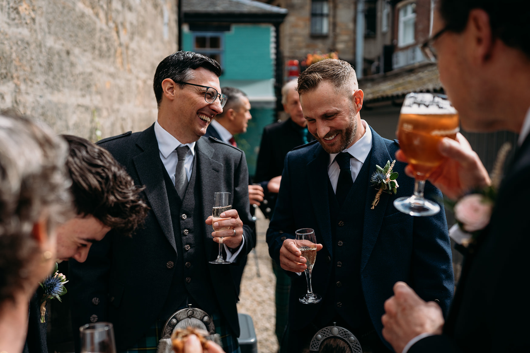 Men laughing at a Glasgow micro wedding at The Bothy