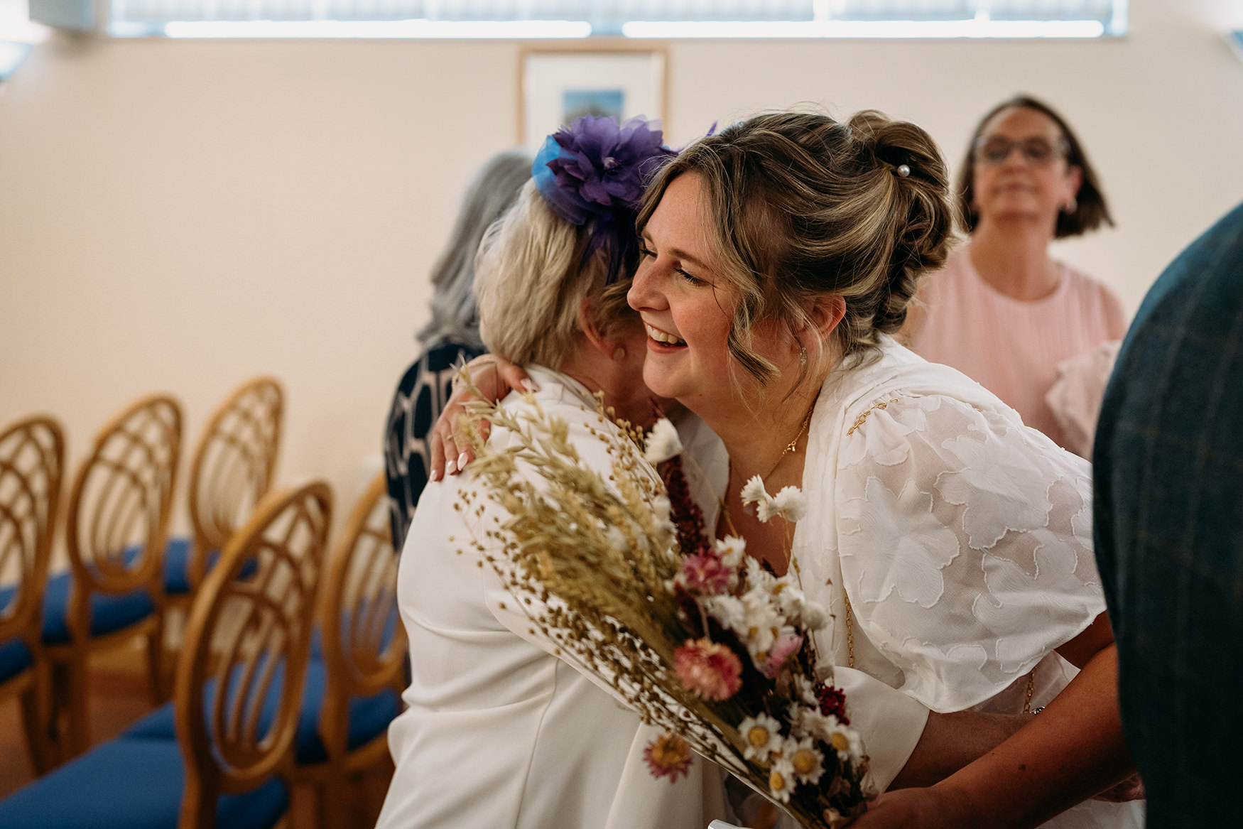 Bride hugs gran at Paisley registry office wedding