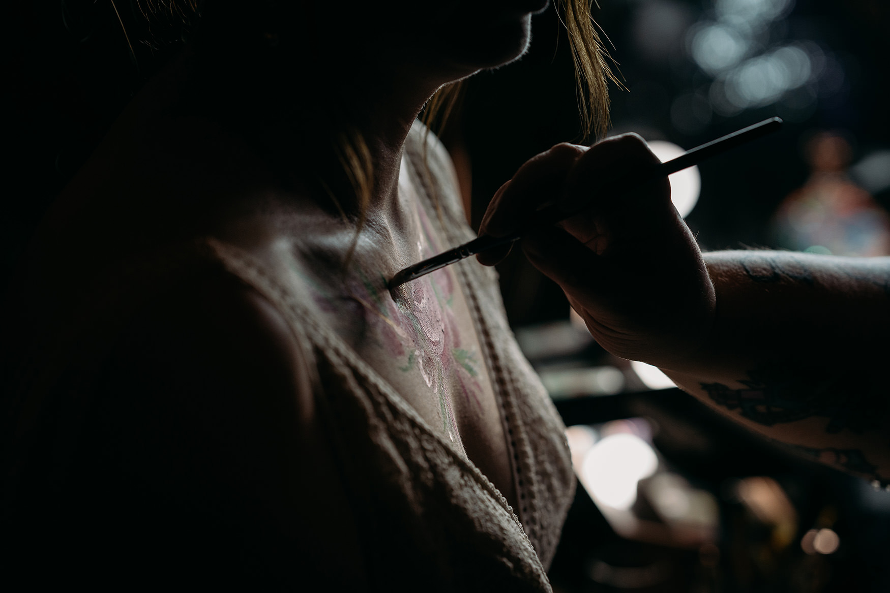 Closeup of Give Good Face Paint painting brides chest at Platform Glasgow wedding