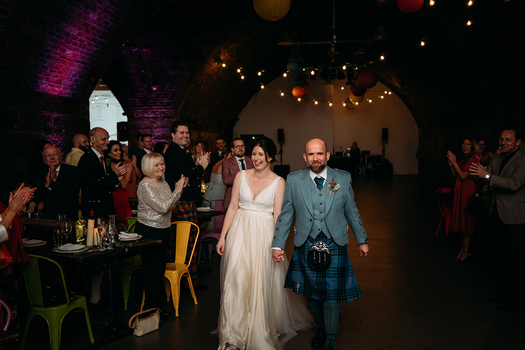 bride and groom walk in for their Platform Glasgow wedding speeches