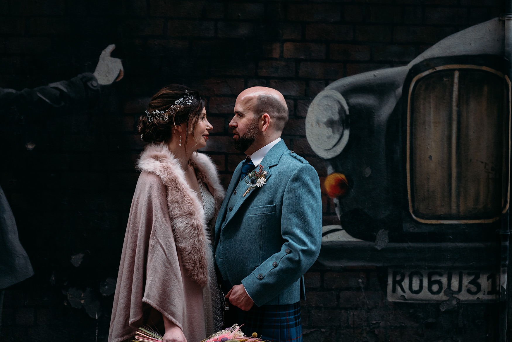 couple and taxi car graffiti during their Platform Glasgow wedding