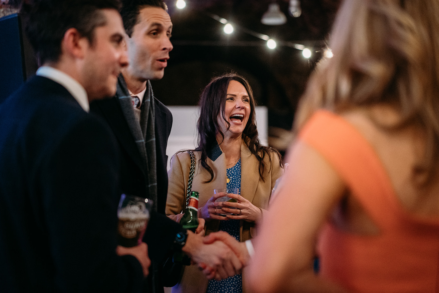 candid photo of people laughing at Platform Glasgow wedding