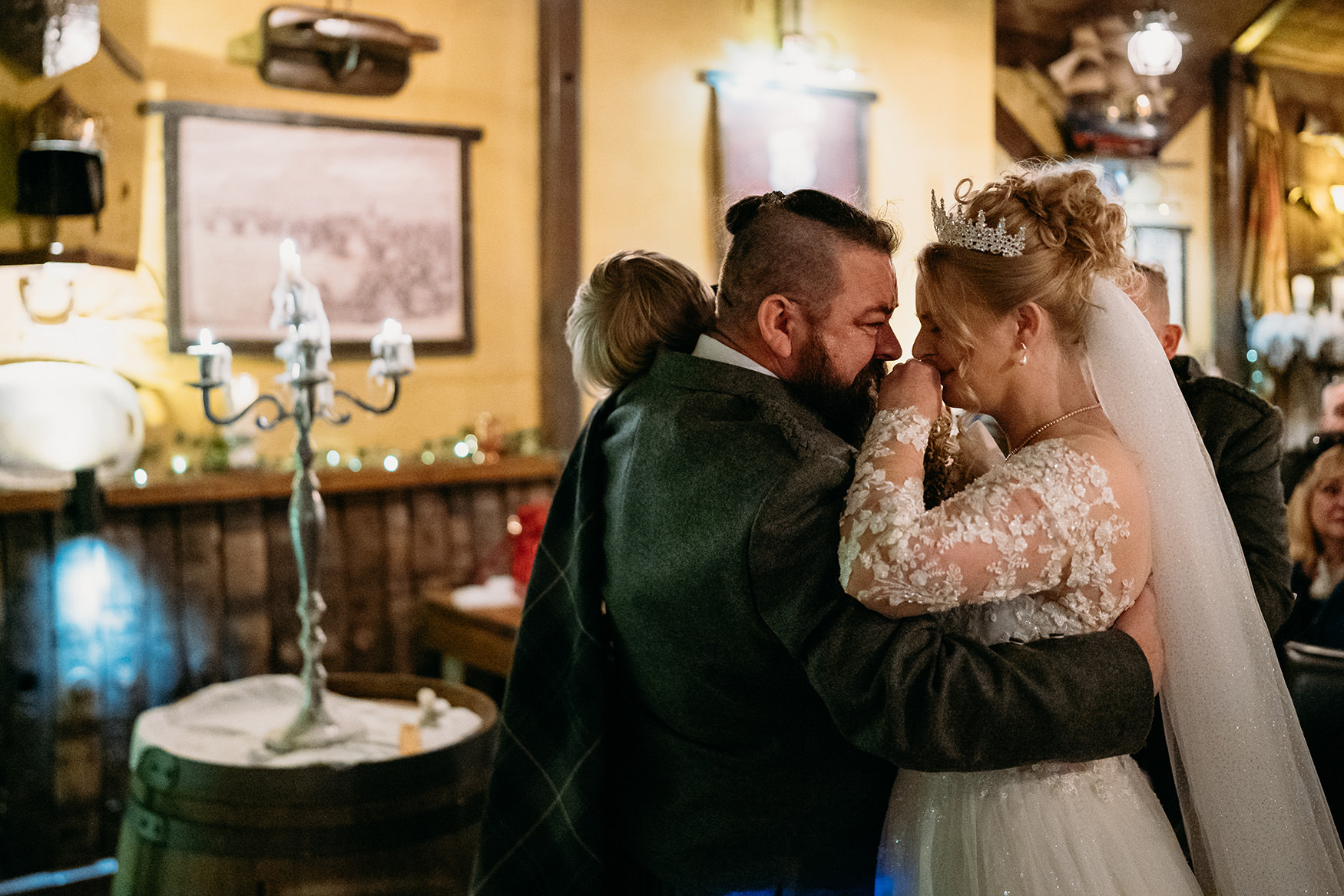 Couple embrace at their The Gathering at Woodhead Farm wedding ceremony